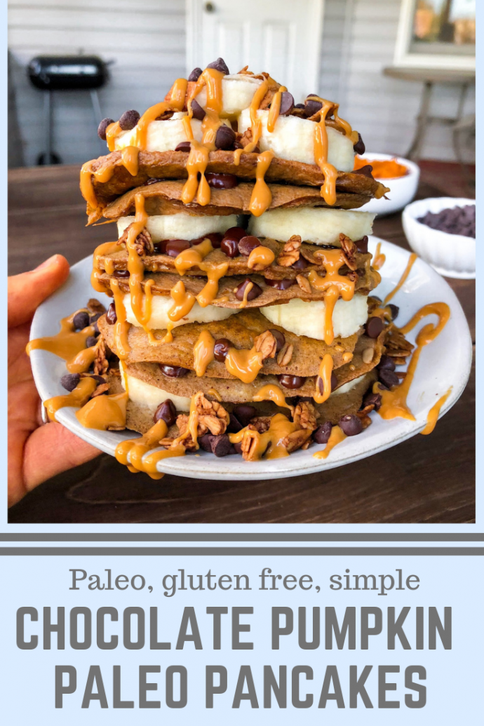 Paleo pancakes with bananas, chocolate chips, peanut butter drizzle on a white plate