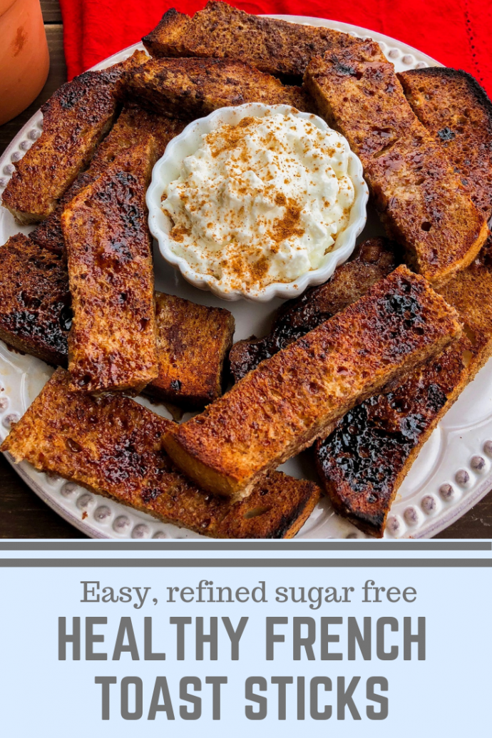 French Toast sticks on a white plate with yogurt and cinnamon