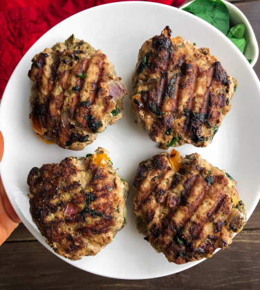 4 turkey burgers on a white plate