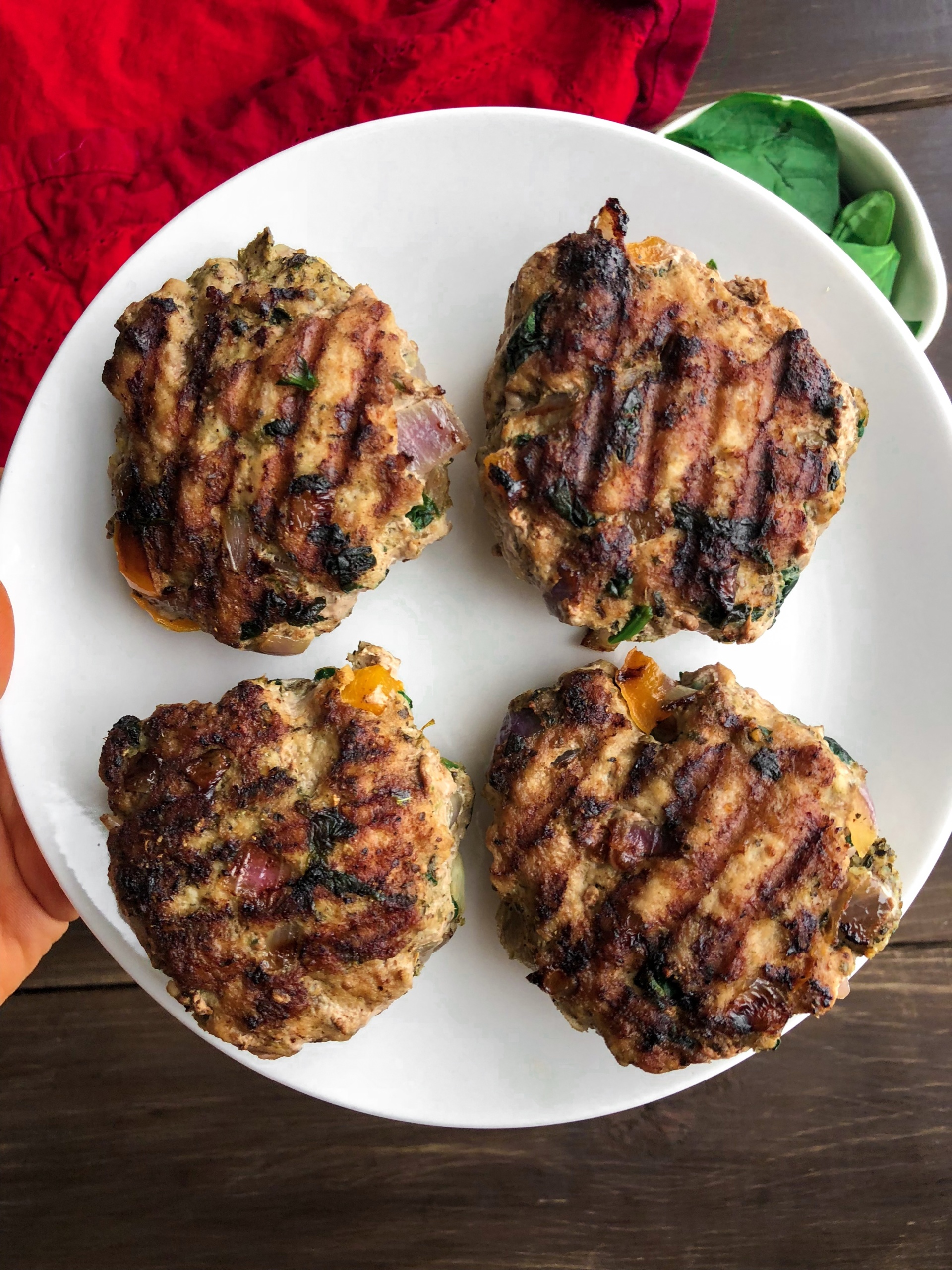 4 turkey burgers on a white plate