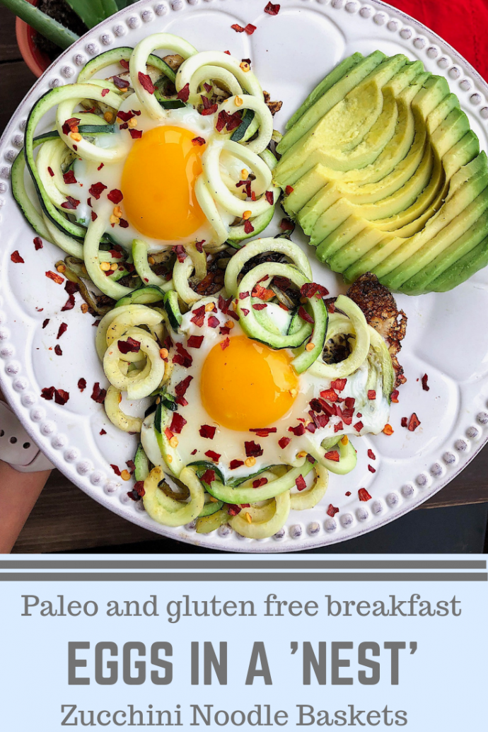 two eggs in zucchini noodles with avocado and red pepper flakes