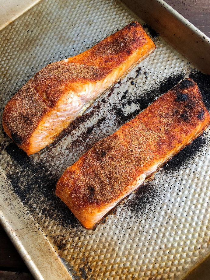 spicy baked salmon on a silver baking pan