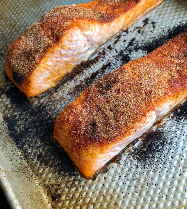 spicy baked salmon on a silver baking pan