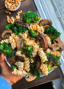 Chickpea pasta, broccoli, pasta sauce, mushrooms, in a bowl