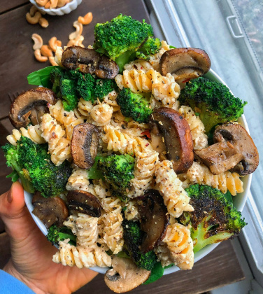 Chickpea pasta, broccoli, pasta sauce, mushrooms, in a bowl
