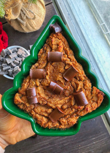 sweet potato bread in a christmas ramekin on a brown wood board