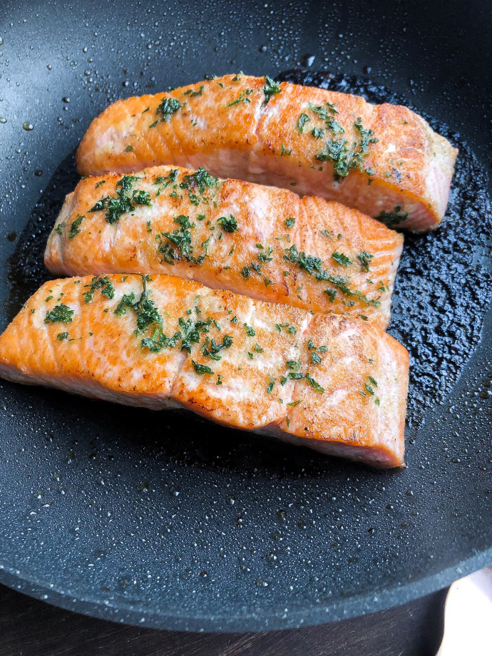 Lemon Garlic salmon on a black pan