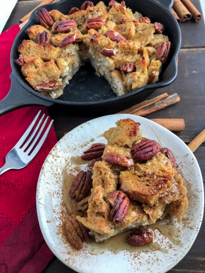 Maple Pecan French Toast bake on a white plate against a wood background