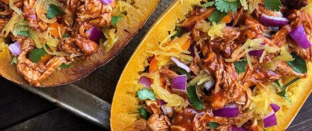 Paleo bbq chicken stuffed spaghetti squash on a silver pan