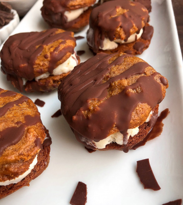 ice cream sandwich with peanut butter cookies on a white plate