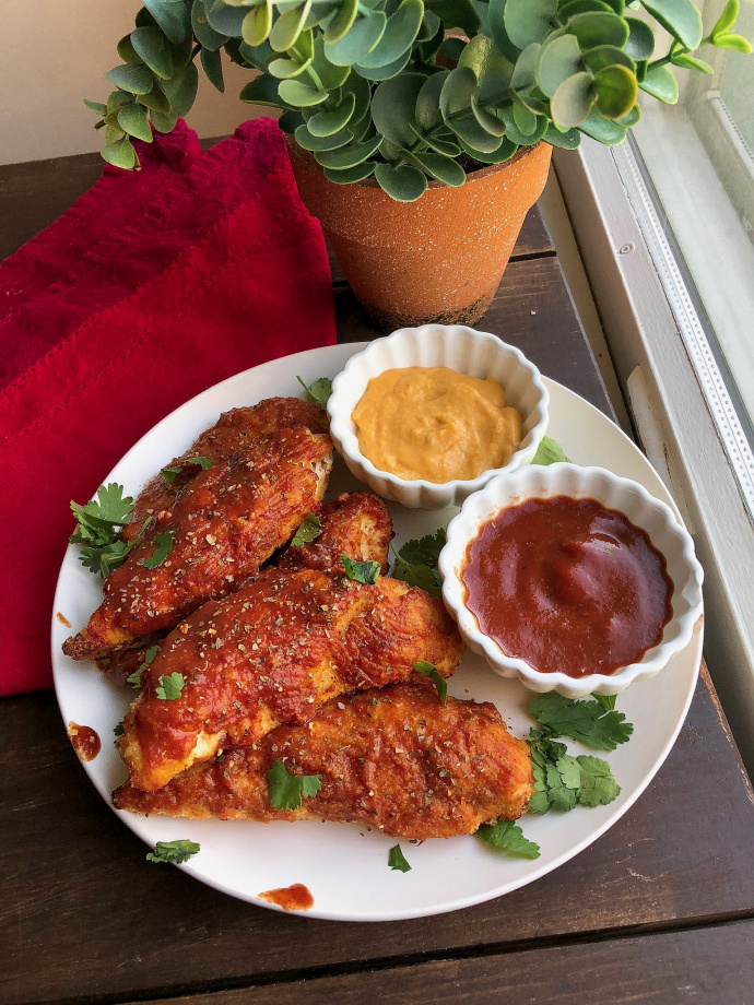 paleo bbq chicken tenders with cheese sauce and bbq sauce to dip