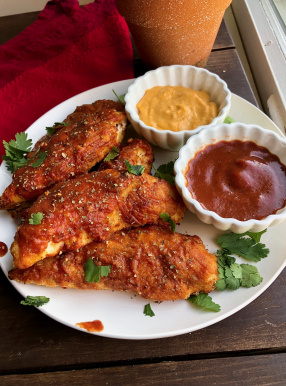 paleo bbq chicken tenders with cheese sauce and bbq sauce to dip