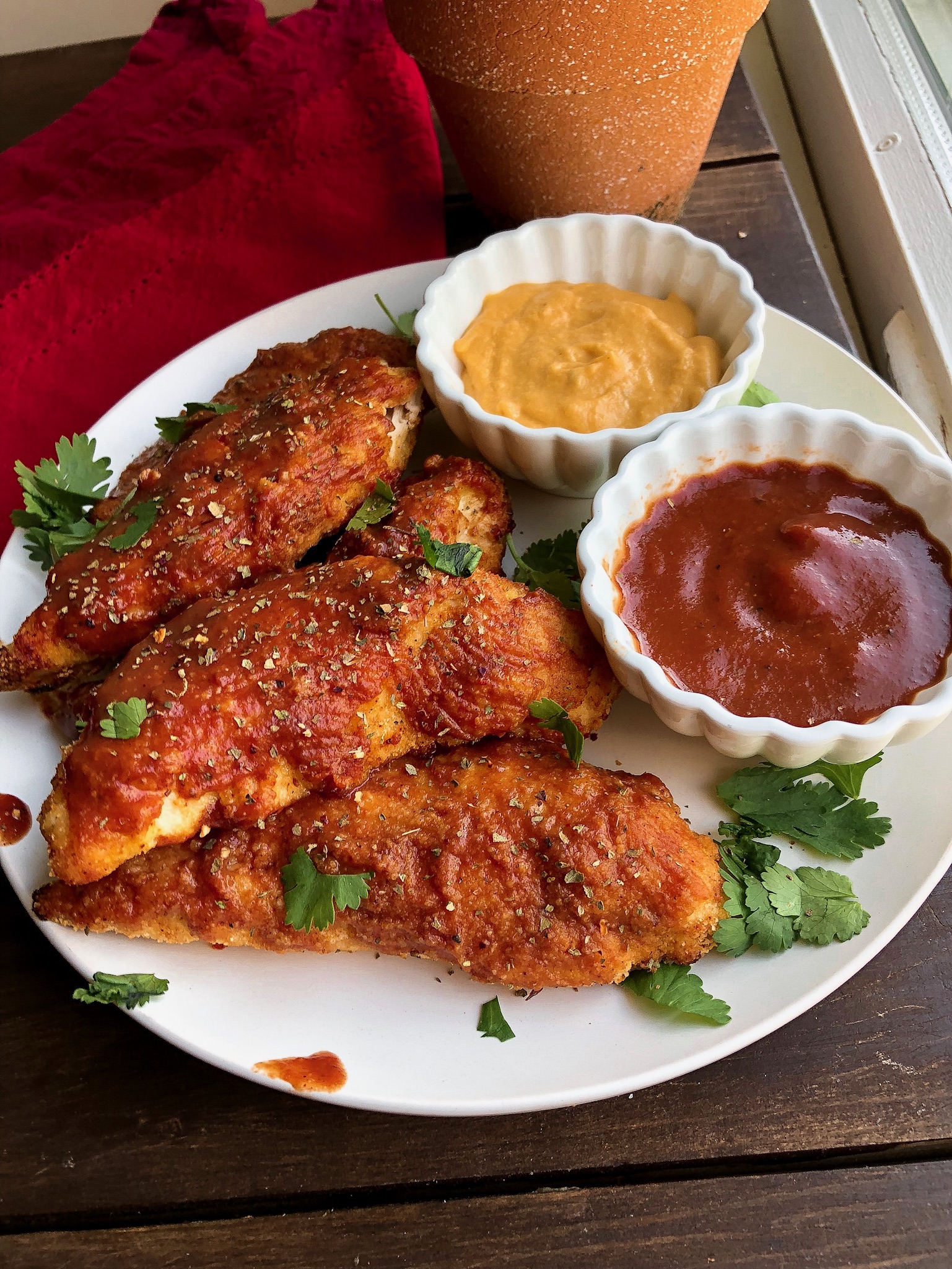 paleo bbq chicken tenders with cheese sauce and bbq sauce to dip