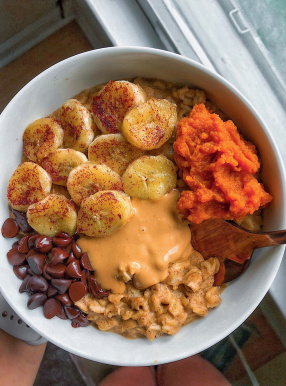 healthy pumpkin stovetop oatmeal in a white bowl