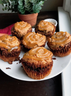 paleo, gluten free cinnamon roll muffins with an easy swirled icing on top.
