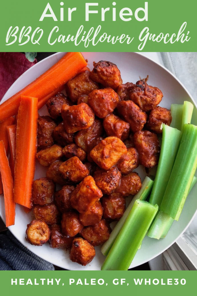 air fried bbq cauliflower on a white plate with carrots and celery