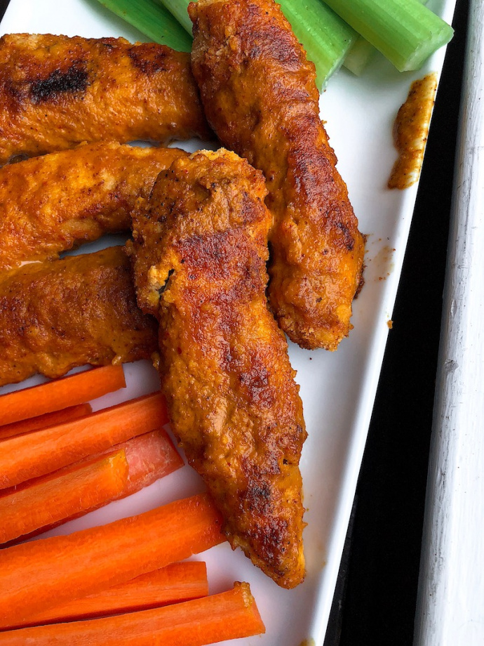 baked buffalo chicken tenders with carrots and celery