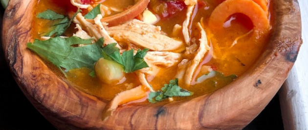 Coconut Curry Chicken Soup in a wooden bowl. Paleo, Gluten free, whole30