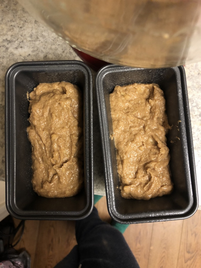 cinnamon banana bread with a cinnamon swirl on a white plate