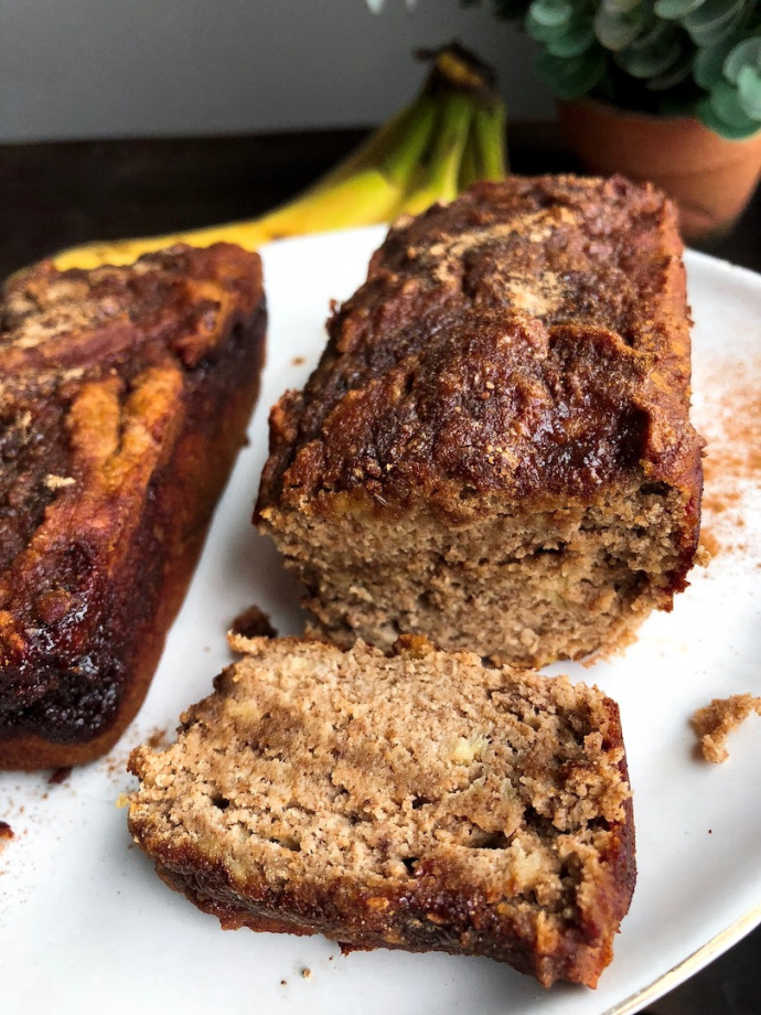 cinnamon banana bread with a cinnamon swirl on a white plate