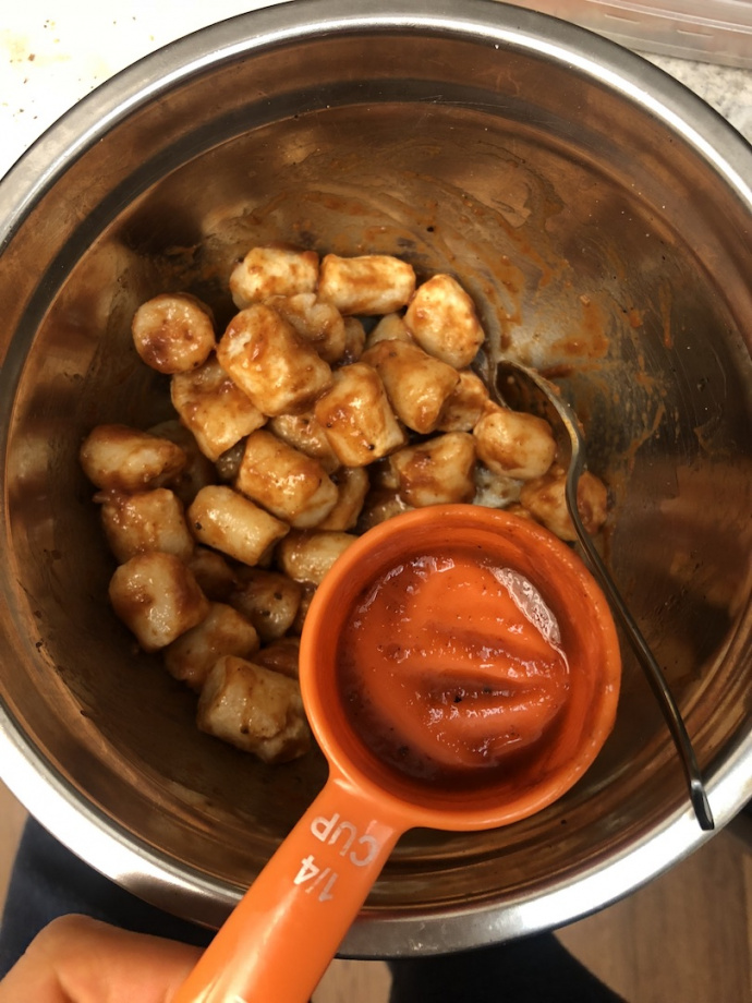 air fried bbq cauliflower on a white plate with carrots and celery