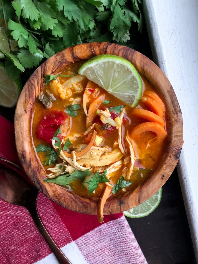 Coconut Curry Chicken Soup in a wooden bowl. Paleo, Gluten free, whole30