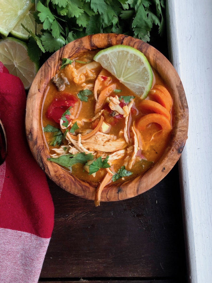 Coconut Curry Chicken Soup in a wooden bowl. Paleo, Gluten free, whole30