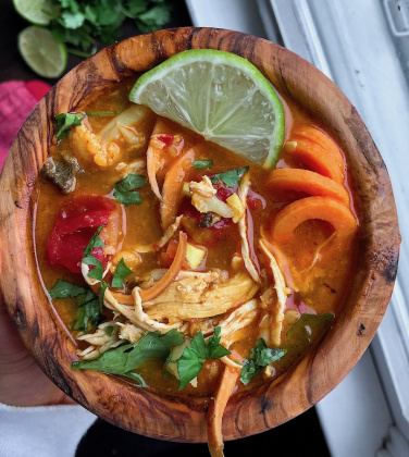 Coconut Curry Chicken Soup in a wooden bowl. Paleo, Gluten free, whole30