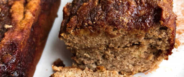 cinnamon banana bread with a cinnamon swirl on a white plate