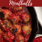 vegan meatballs in a red sauce in a cast iron pan