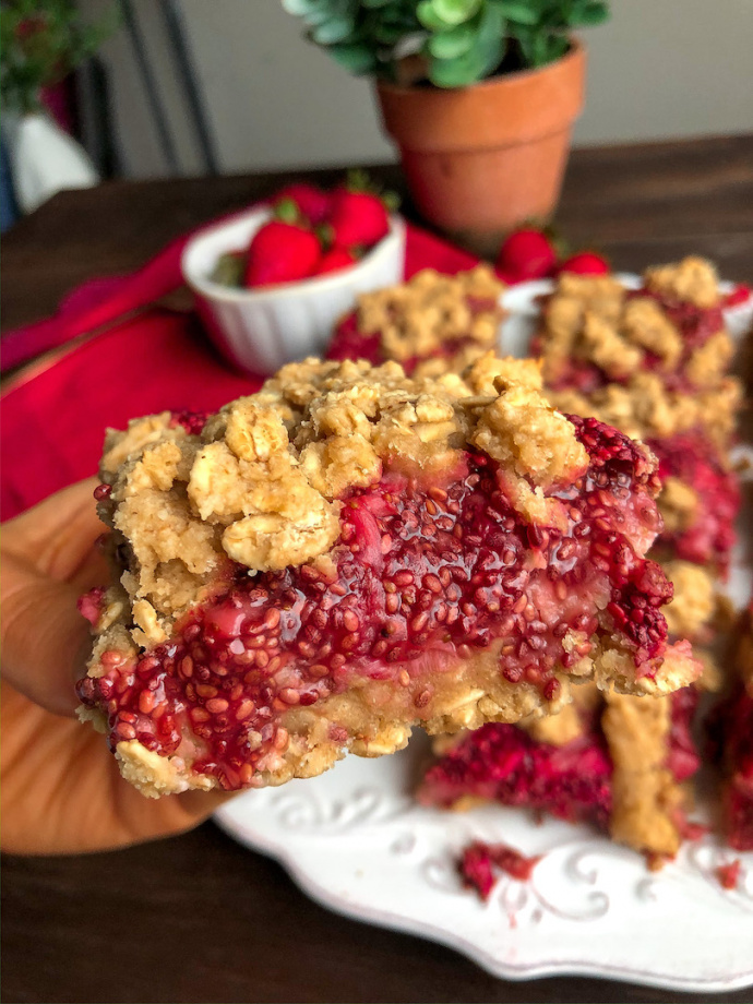 strawberry crumble bars on a white plate