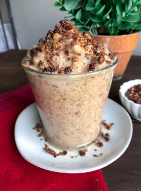 Banana Cookie Dough Smoothie in a glass jar with granola on top