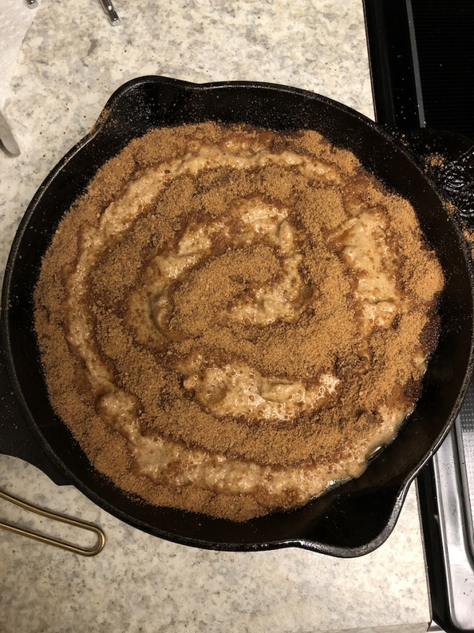 cinnamon swirl banana bread in a cast iron skillet