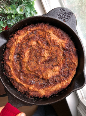 cinnamon swirl banana bread in a cast iron skillet