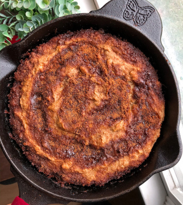 cinnamon swirl banana bread in a cast iron skillet